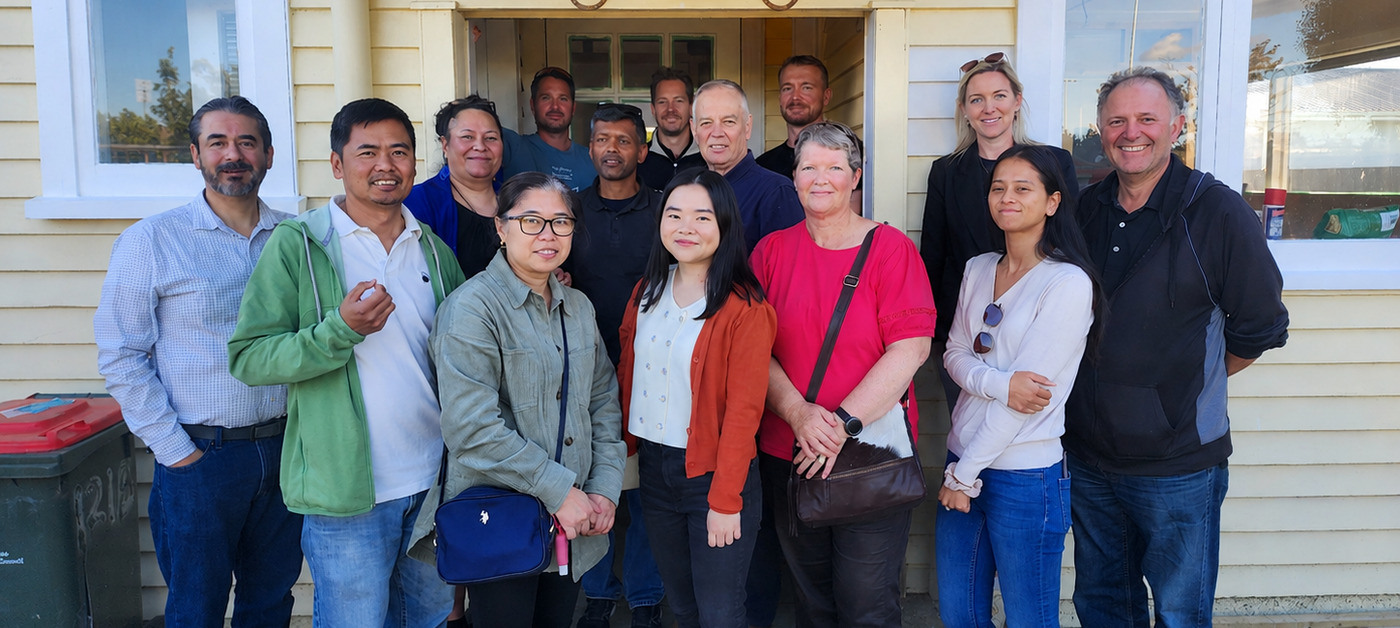 Wealth Mentor members together outside a property